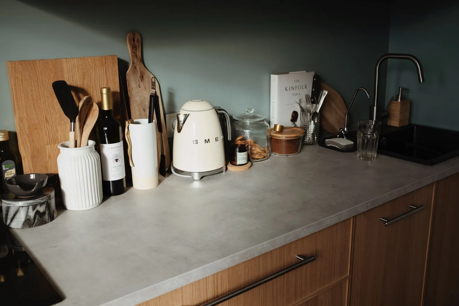 A clean, well-stocked kitchen counter with cookware and appliances